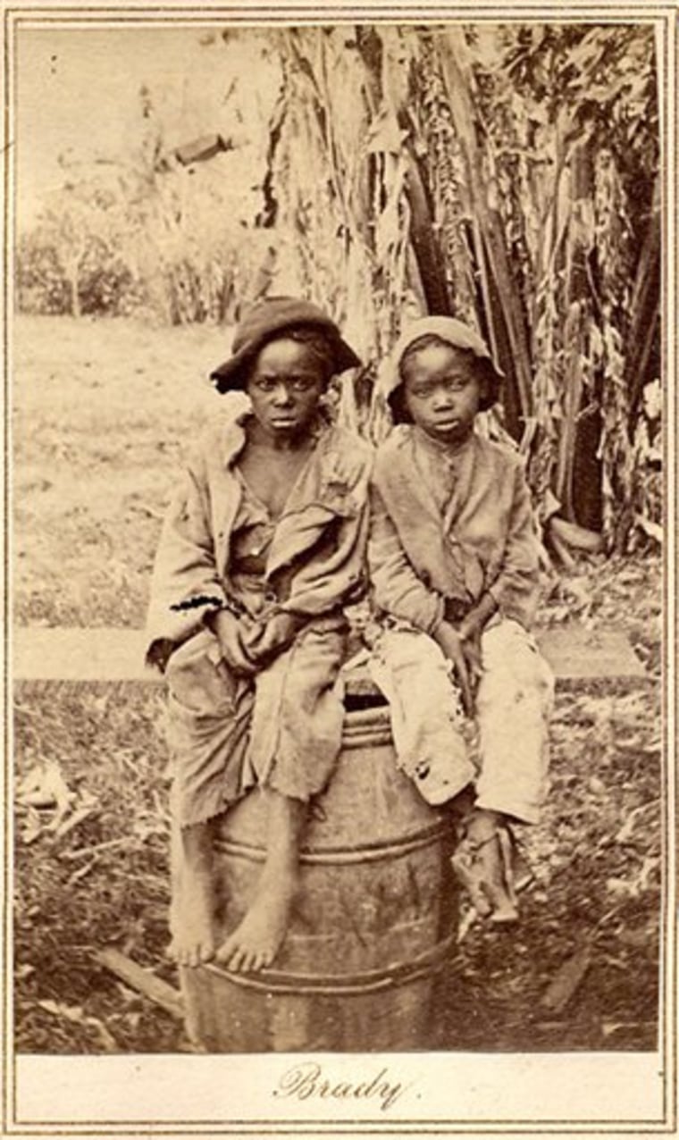 An undated rare photo provided by Keya Morgan, found in a North Carolina attic, depicts two slave children, art historians say. In April, the photo was found at a moving sale in Charlotte, accompanied by a document detailing the sale of John for $1,150 in 1854. The picture was purchased for $30,000 by collector Keya Morgan. 